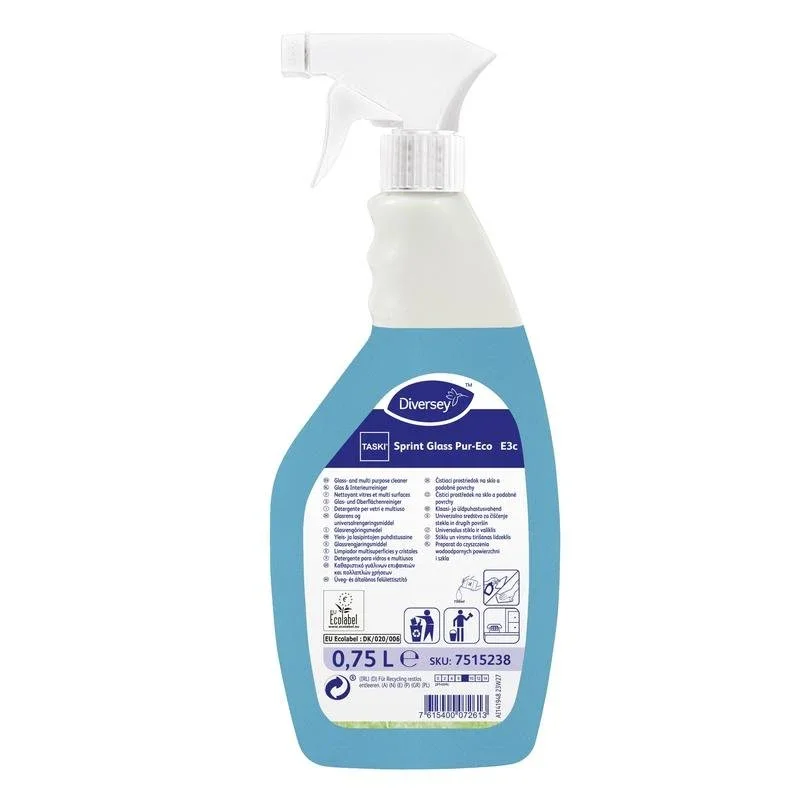 Eine weiĂ-blaue SprĂŒhflasche mit der Aufschrift âTASKI Sprint Glass Pur-Eco Glas- und OberflĂ€chenreinigerâ der Diversey Deutschland GmbH & Co. OHG enthĂ€lt 0,75 Liter umweltfreundlichem Reiniger, mit Gebrauchshinweisen auf dem rĂŒckseitigen Etikett.