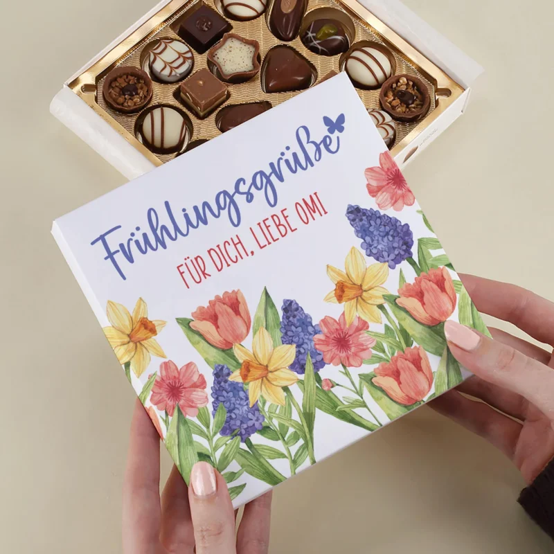 Personalisierte Lindt Pralinenbox Frühlingsgrüße mit Blumenmotiv und Wunschtext